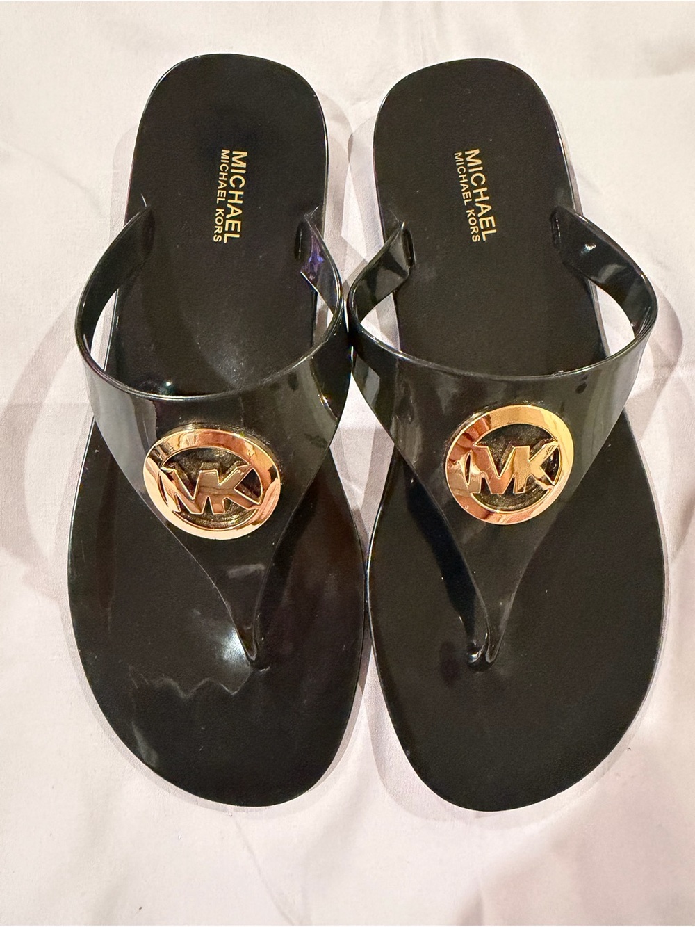 Michael Kors Black Jelly Flip Flop Sandals with Gold MK Medallion